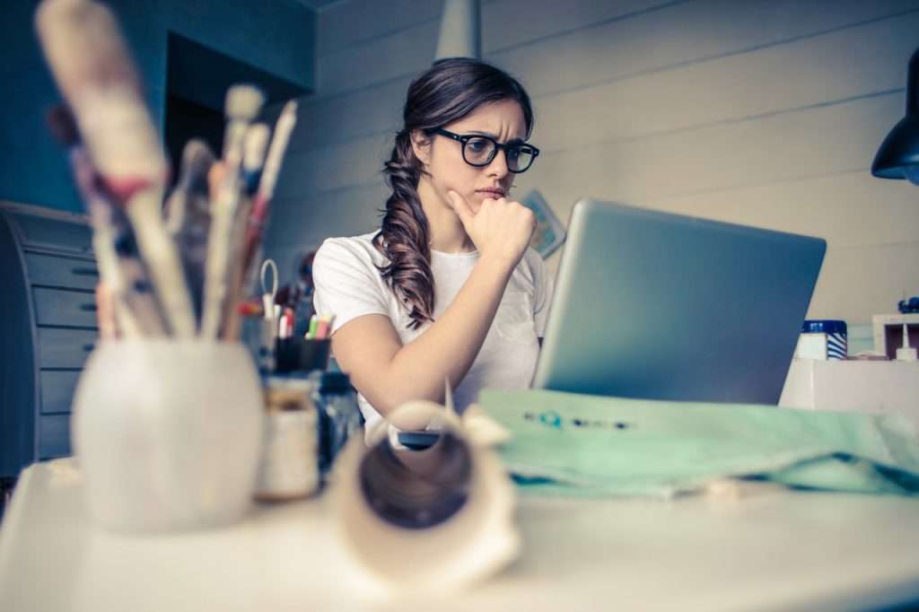 woman using computer and planning an rv trip