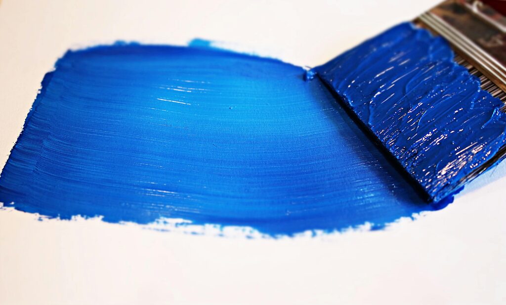 paint brush with blue paint